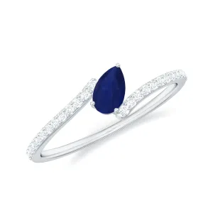 Tilted Pear Cut Blue Sapphire Solitaire Bypass Ring with Diamond